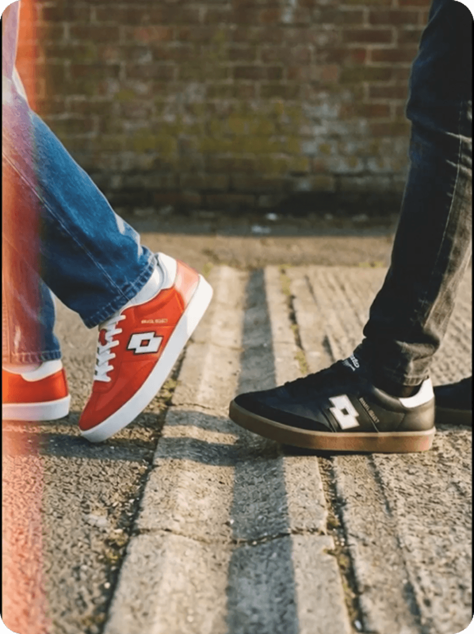 Two sneakers facing each other in an editorial street shot