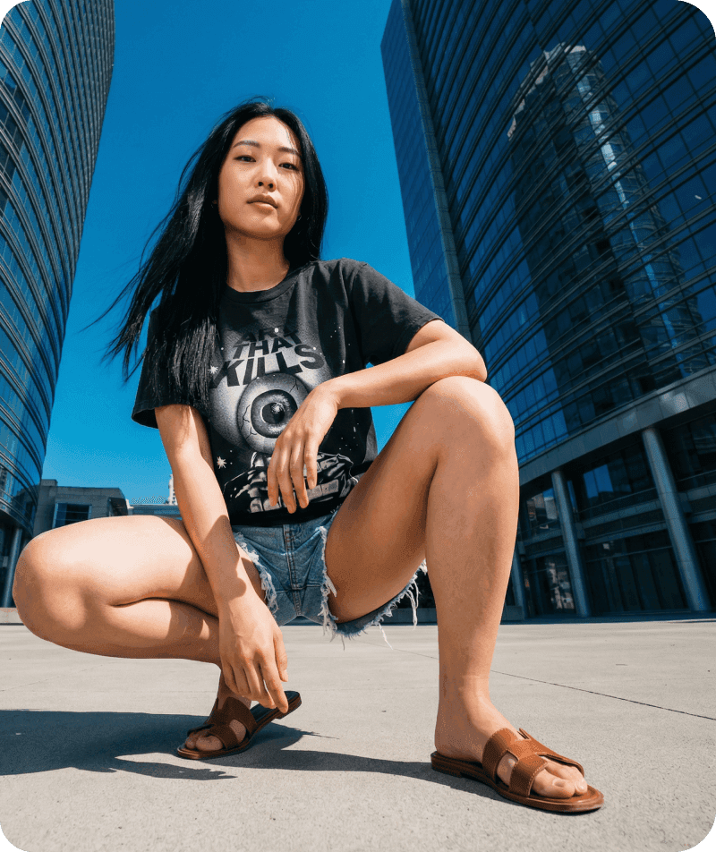 Woman crouching in an urban streetwear portrait