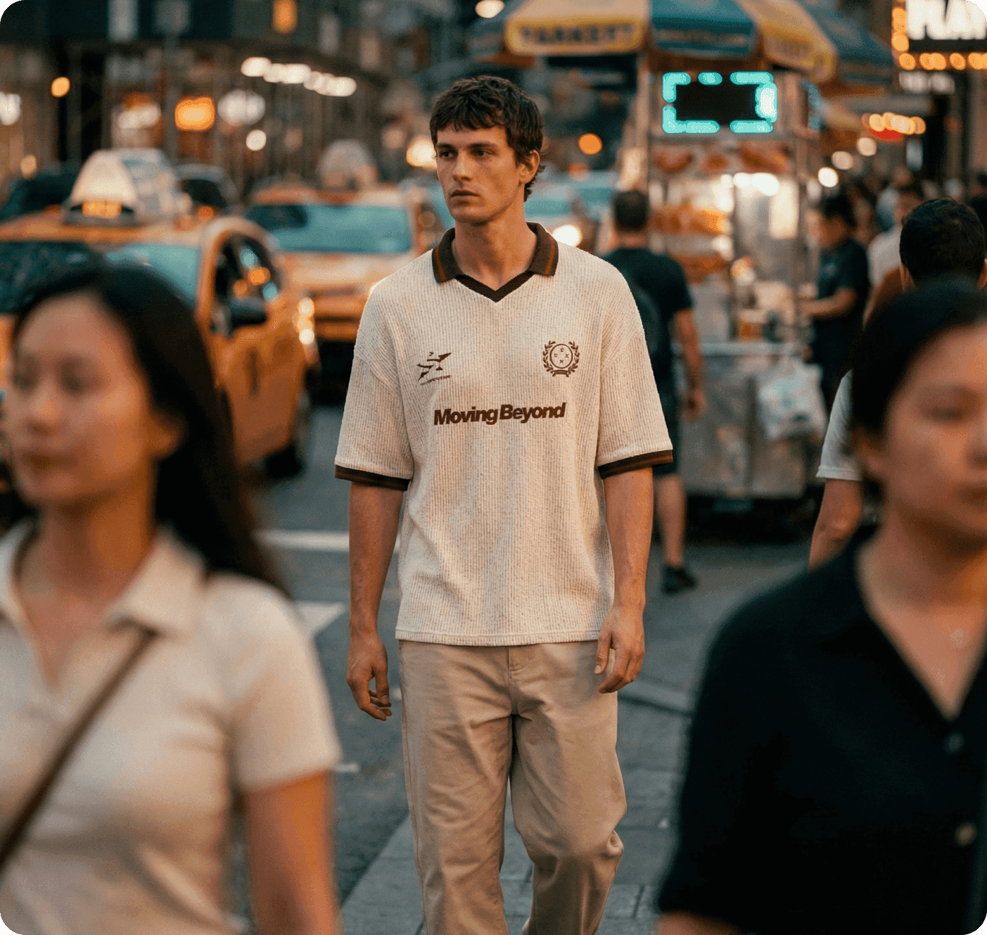 Male model walking in a busy city street