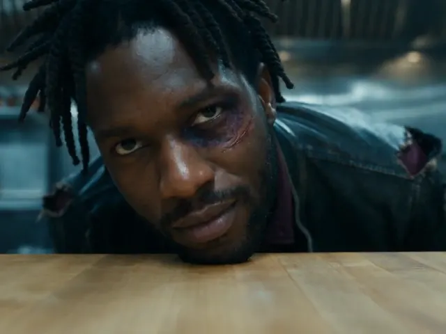 A close-up portrait at a table